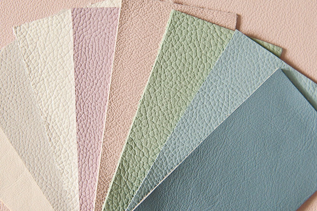 Swatches of leather fabric in different pastel colours