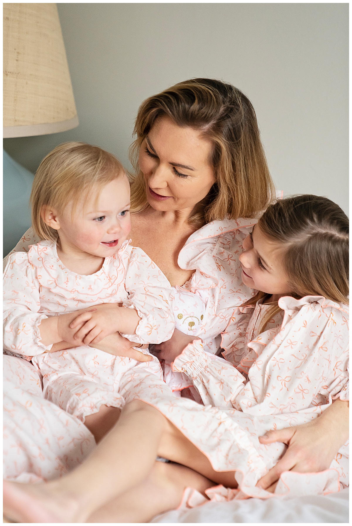 Lauren de Graad founder of Heidi Rose London with her two daughters wearing matching mother and me nightwear.
