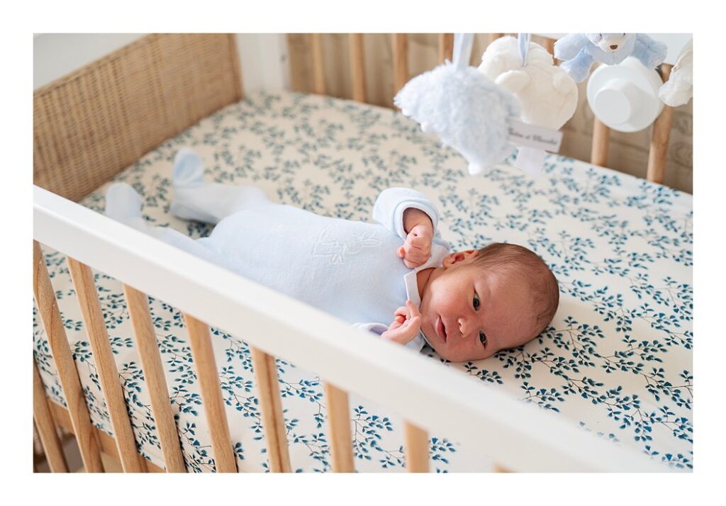 newborn baby in his crib